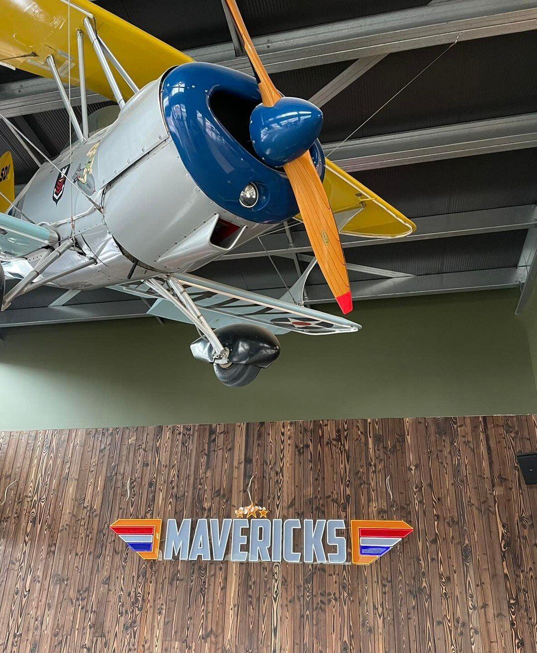 Photo by user maverickstaupo, caption reads What are you up to in a couple of weeks?? Looks like we’ll be serving you Nitro Espresso Martinis and delicious share plates under this plane!! 

Keep an eye on our Instagram stories (maverickstaupo) for updates on the build & opening, she’s coming together quickly! 

#mavericksgastropub #taupoeats #lovetaupo #espressomartini #taupopub #topgun